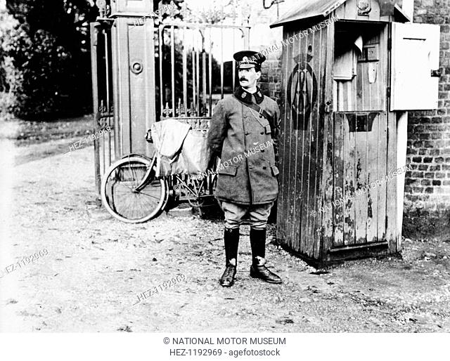 Early AA telephone box, (c1900s?). An AA man and his bicycle outside a roadside call-box
