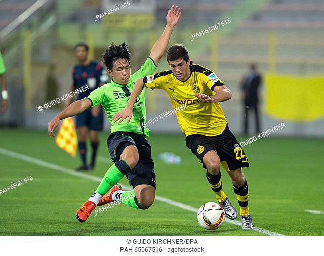 Dortmund's Christian Pulisic (r) and Jeonbuk's Ong Dong-kyun vie for the ball during a friendly match between Jeonbuk Hyundai Motors FC and Borussia Dortmund in...
