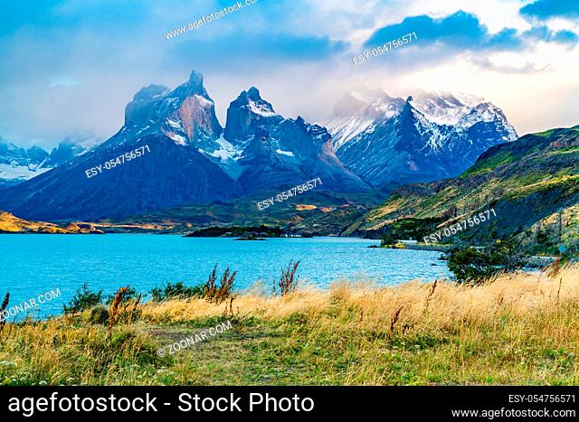 Beautiful foggy Cuernos del Paine Mountain in the evening with Lake Pehoe at Torres del Paine National Park in Chilean Patagonia, Chile