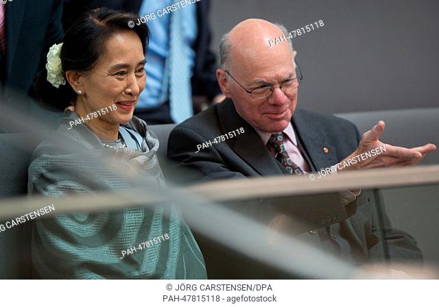 Myanmar opposition leader Aung San Suu Kyi and President of the German Bundestag Parliament Norbert Lammert (CDU) sit in the visitors stand during the household...