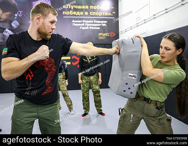 RUSSIA, GUDERMES - FEBRUARY 27, 2023: An instructor and students are seen during a training session of the ""Female Bodyguard"" close protection course at...