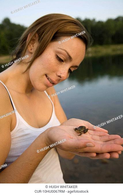 Woman holding frog