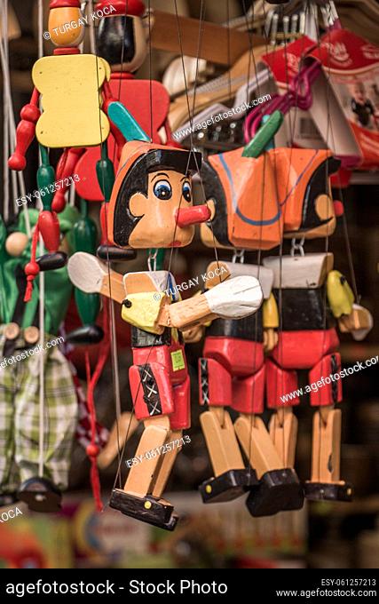 Set of wodden puppet Pinocchio in outdoor bazaar