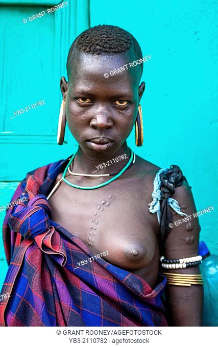 Portrait Of A Young Woman From The Mursi Tribe, Jinka, Omo Valley, Ethiopia
