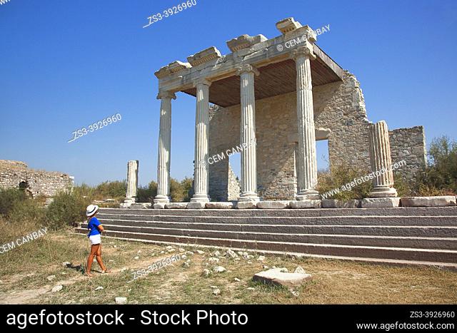 Tourist woman in front of the Ionic Stoa in the Archeological area of Milet, Miletus, Aydin Province, Turkey, Europe