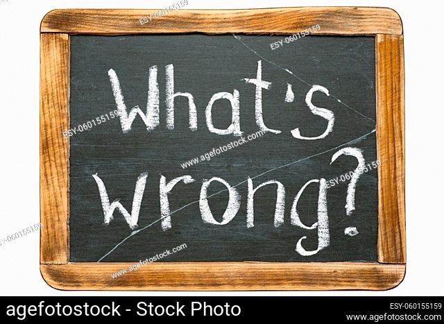 what's wrong question handwritten on vintage school slate board isolated on white