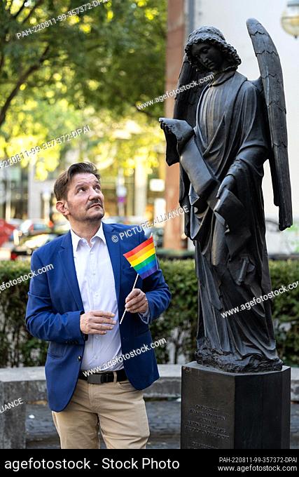 11 August 2022, Hessen, Frankfurt/Main: Georgios Kazilas, Lesbian and Gay Association (LSVD), stands at the monument ""Frankfurter Engel""