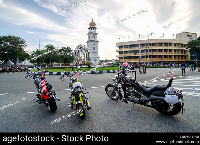 Georgetown, Penang/Malaysia - Aug 31 2016: Motorcycle with Malaysia flag park in front Jubilee Clock Tower