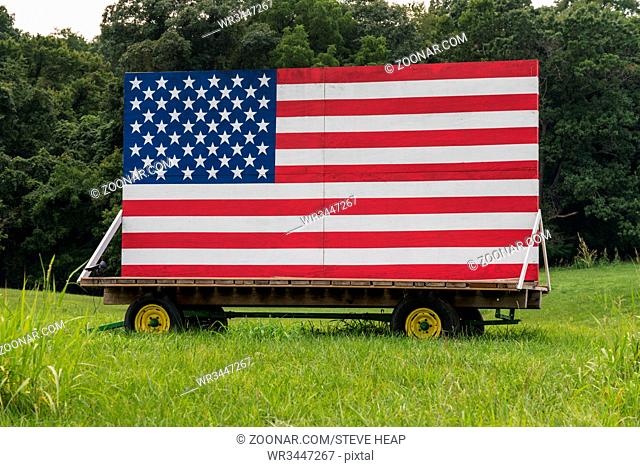 US flag painted onto a large billboard in a roadside field in Virginia