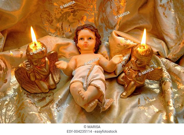 Christmas card, baby Jesus and two lighted candles