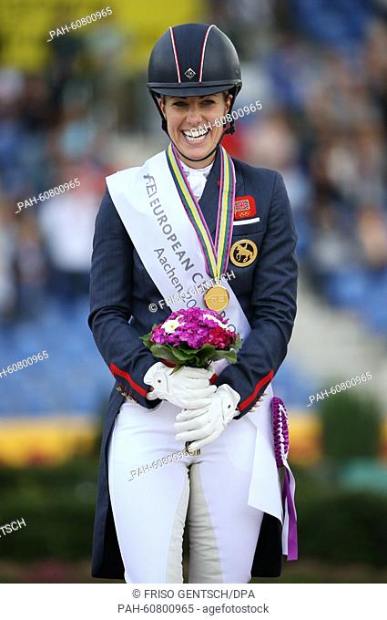 Gold medal winner Charlotte Dujardin of Great Britain celebrates at the medal ceremony after the Grand Prix Special Dressage Individual Final during the FEI...