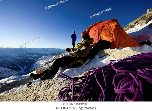 Mountaineer with rope and tent bivouac at Olperer, Tuxer Alps, Zillertal, Tyrol, Austria
