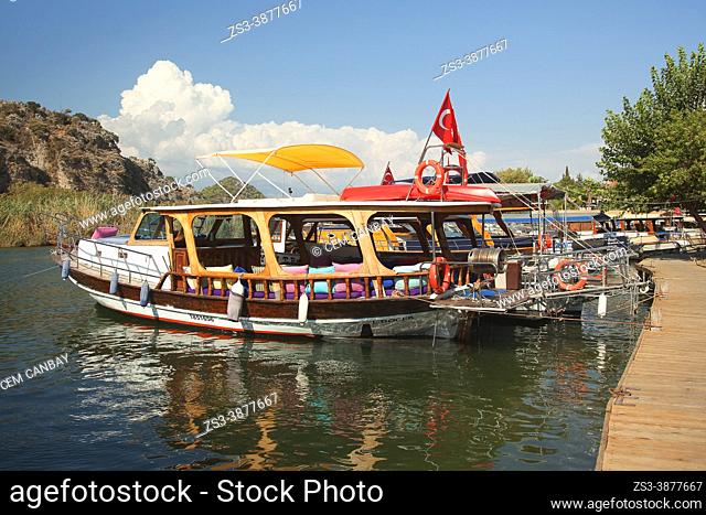 Touristic river boats moored on the wooden pier inside the harbour of Dalyan village in the morning light, Dalyan Delta, Mugla Province, Aegean Region, Turkey