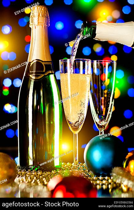 bottle champagne stream and splash in glass goblet, beautiful celebrations concept photo