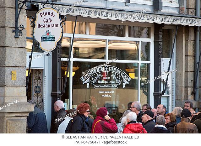 Tourists stand in front of the heritage listed dairy shop 'Pfunds Molkerei' in Dresden, Germany, 10 Decemeber 2015. One of the attractions of the dairy shop is...