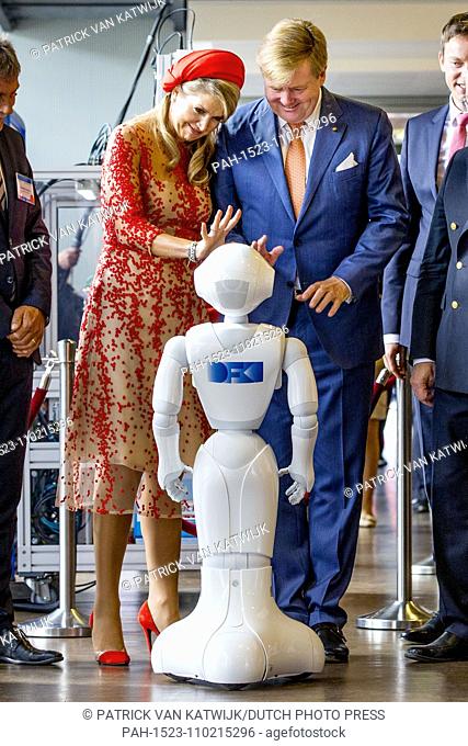 King Willem-Alexander and Queen Maxima of The Netherlands get a tour from a robot during their visit to the University of Saarbrucken , Germany, 11 October 2018