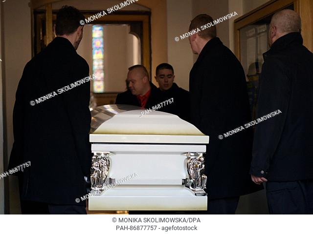 The coffin of the Polish truck dirver killed during the terror attack on Berlin Lukasz U. is carried into a church during a funeral service in Banie, Poland