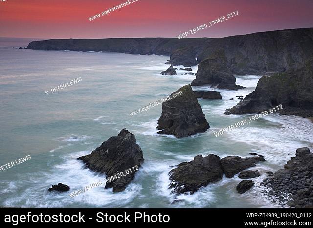 Coastline scenery - rocks in sea at sunset UK - England Cornwall Bedruthan Steps