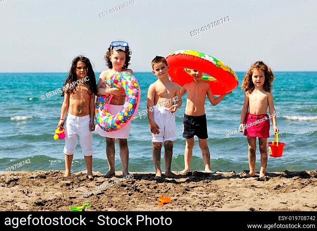 child group have fun and play with beach toys