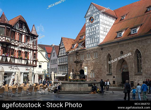 Reutlingen, Baden-Wuerttemberg, Germany, Europe - City image with market square around Maximilian fountain and ancient timbered houses along Wilhelmstrasse in...