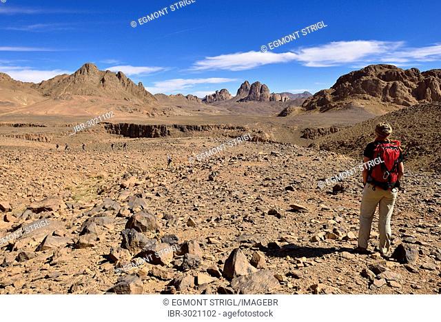 Female hiker standing in the volcanic landscape at Atakor