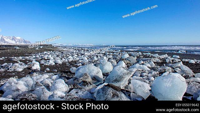 ice fields at the black pebble beach, coast of iceland