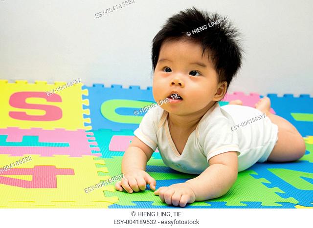 Little baby crawling on floor