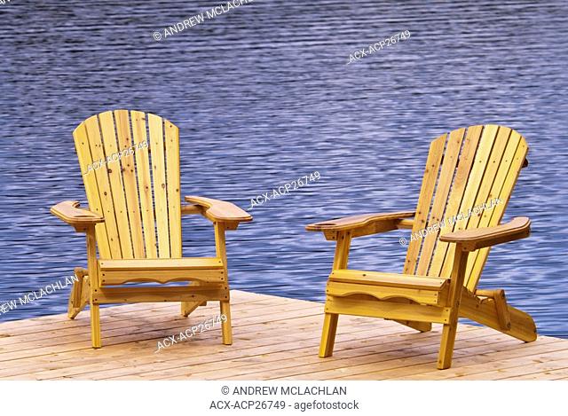 Muskoka chairs on dock at Horseshoe Lake near Parry Sound Ontario