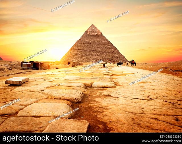 Egyptian pyramid in sand desert and clear sky