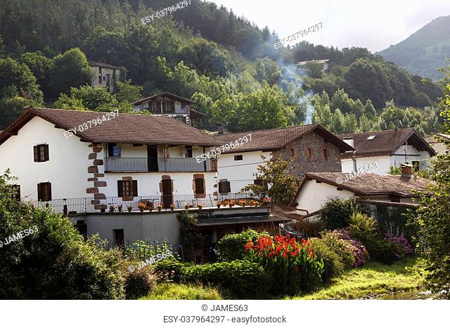 Stone houses and ornate wood very typical in the beautiful village of Etxalar, Spain
