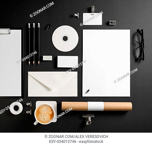 Blank stationery set on black paper background. Template for branding identity. For graphic designers presentations and portfolios. Top view. Flat lay