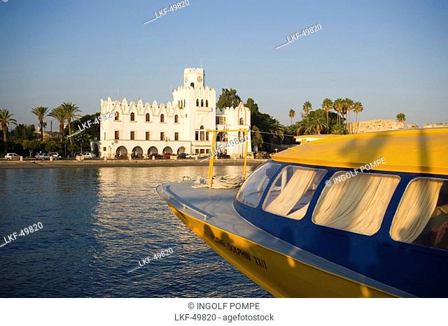 View over a boat to the Palazzo di Giustizia, built 1928 during the italian occupying time, Kos-Town, Kos, Greece