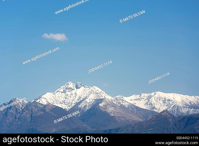 Snow-capped Mountain and One Cloud on Blue Sky in Locarno, Switzerland