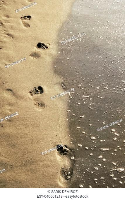 close up footprints on beach