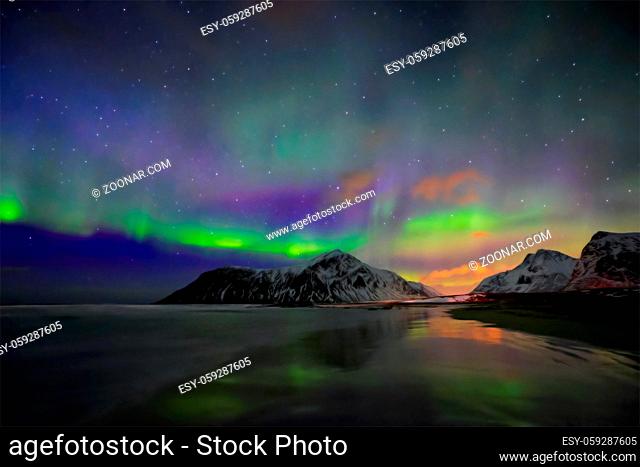 Aurora borealis northern lights on Skagsanden beach. Lofoten Islands, Norway