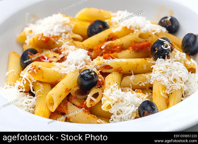 penne pasta with tomato sauce, black olives and parmesan cheese