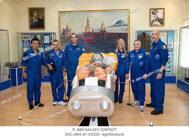 At the Baikonur Cosmodrome in Kazakhstan, the Expedition 3637 prime and backup crews pose for pictures in the Korolev Museum May 24 following the final fit...