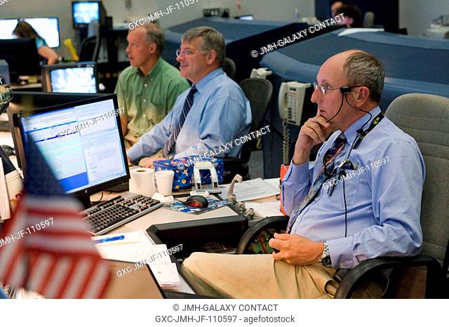 STS-127 flight director Paul Dye (foreground) is on console on the July 17 Orbit 1 shift during docking of STS-127 Endeavour to the International Space Station
