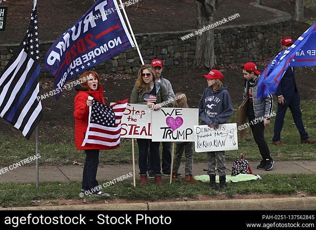 Demonstrators gather outside of the Trump National Golf Club Washington DC in Sterling, Virginia, on Sunday, November 22, 2020 in Washington, DC