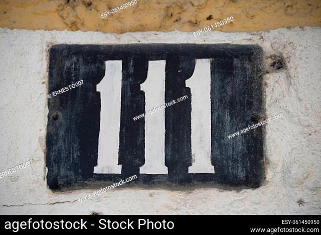 number 111 on a house in Lisbon - Lisboa - the capital of Portugal, September, 2018
