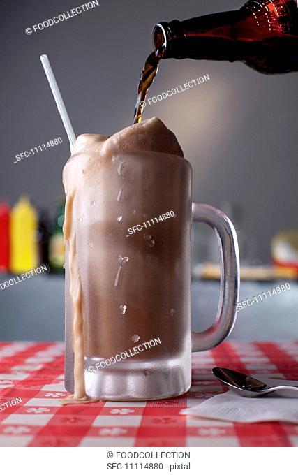 Root Beer Pouring into a Root Beer Float