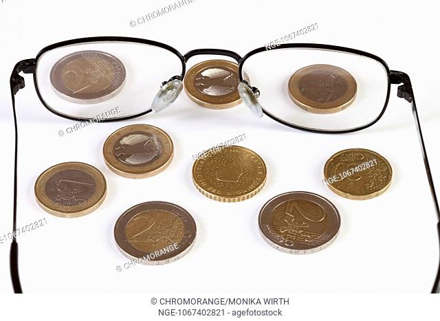 Glasses and Euro coins