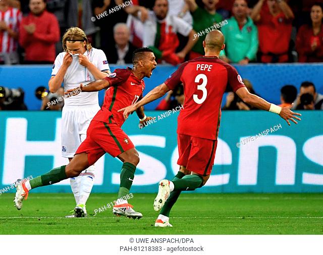 Nani (C) of Portugal celebrates after scoring the leading goal with teammate Pepe during the UEFA Euro 2016 Group F soccer match Portugal vs