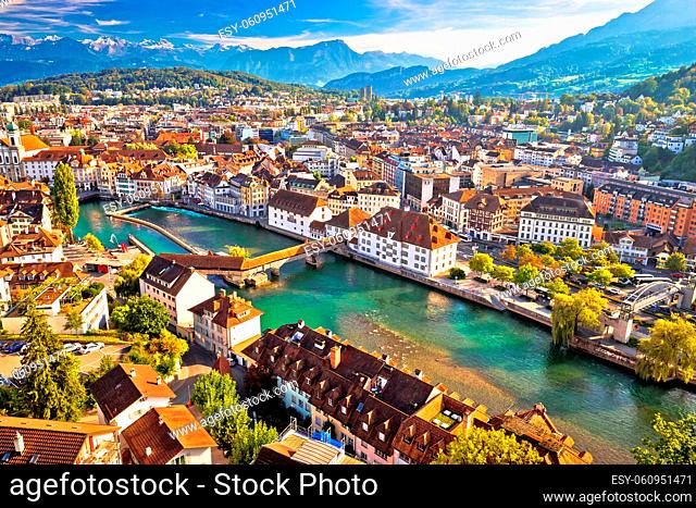 City of Luzern riverfront and rooftops aerial view, Alps landscape of Switzerland