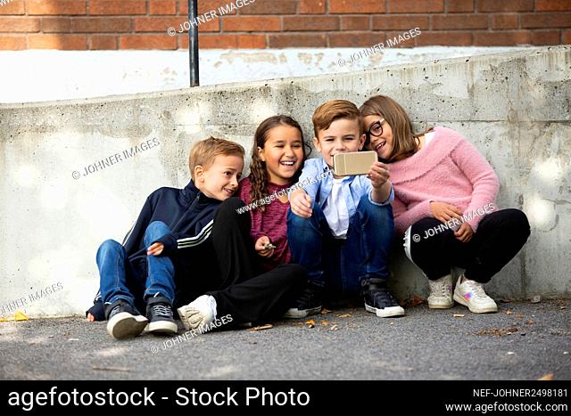 Children taking selfie