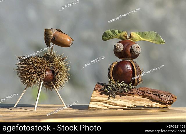 Sheep and owl, funny animal figures made from chestnuts and oak acorns in autumn time, Switzerland