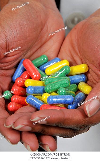 Woman holding prescription medicine narcotics or opioids