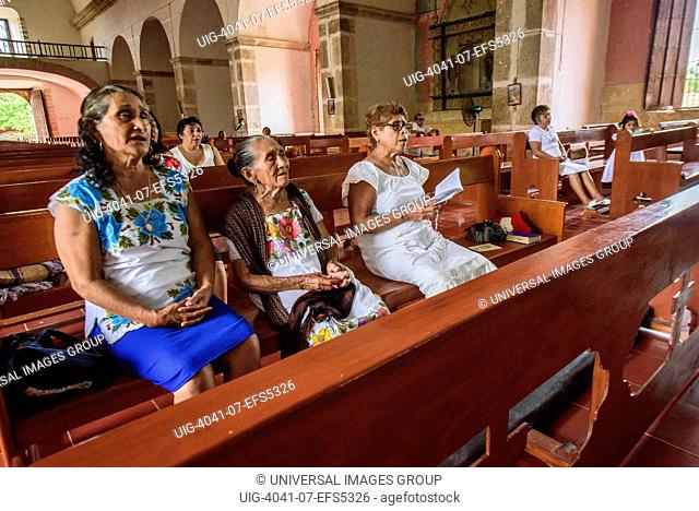Women praying in the church of the convent of Mama, Yucatan, Mexico
