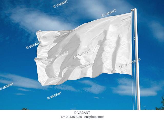 blank white flying flag on a clear sky