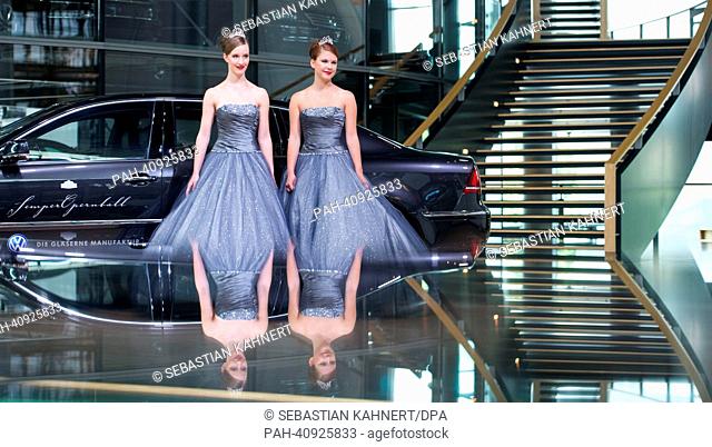 Debutants Johanna (L) and Elisabeth pose in the Volkswagen's Transparent Factory in Dresden, Germany, 09 July 2013. The 2014 Semper Opera Ball will take place...